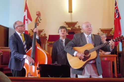l-r Brian, Mary and Wayne Abrams perform at the 130th Anniversary celebrations at the Snow Road Presbyterian church where Rev. Karen Hincke led the service